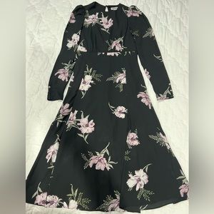 The brand is Chelsea28. It is XS, and the colors are black, purple, and green.